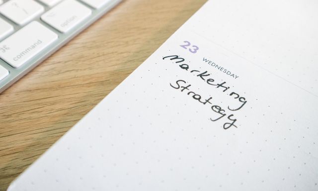 a calendar next to a laptop